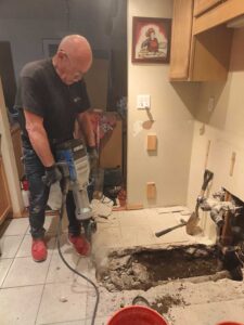 Plumber Repairing Sewer Pipe