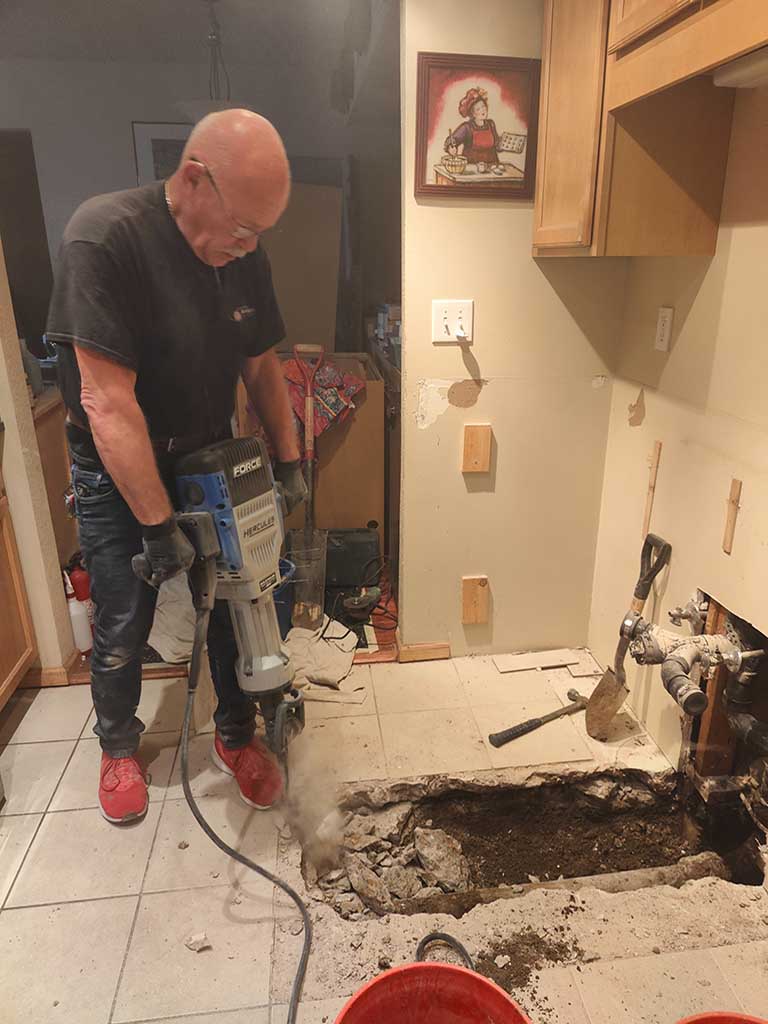 plumber repairing a sewer pipe