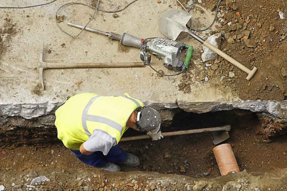plumber repairing sewer