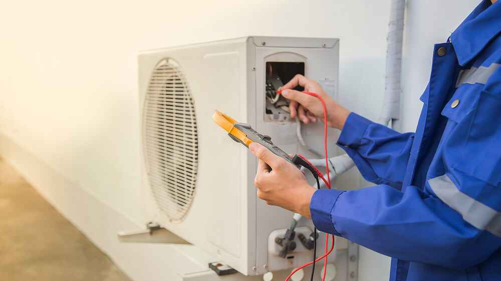 technician checking the air conditioner